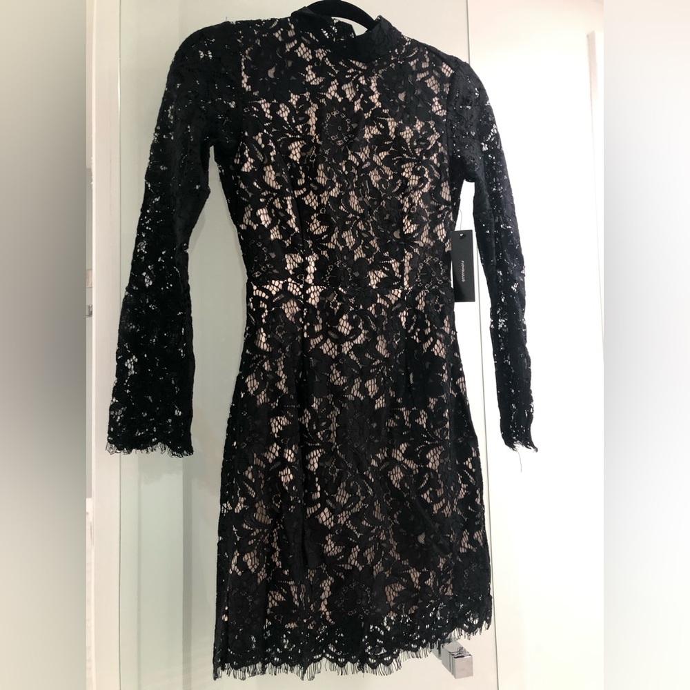 Fancy crochet black and cream dress. New with tag.